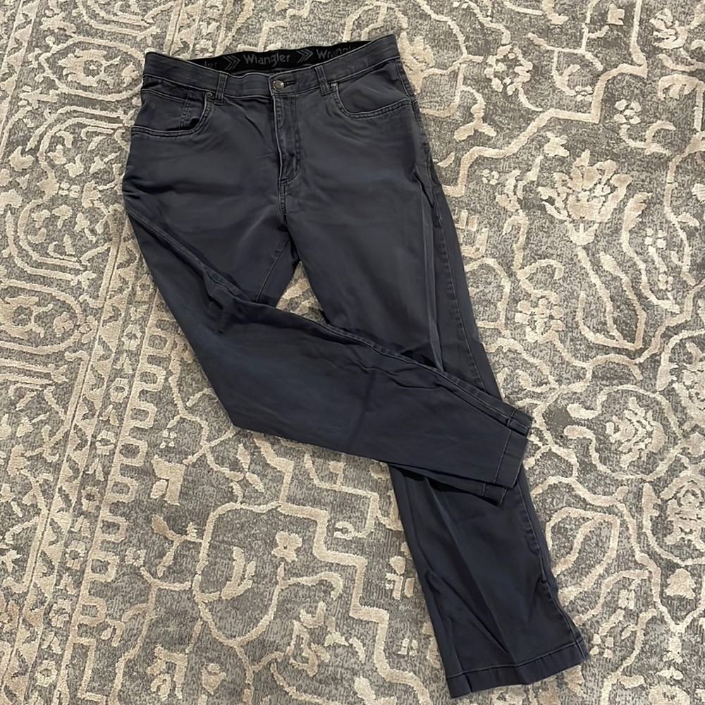Dark grey Wrangler relaxed fit pants.
